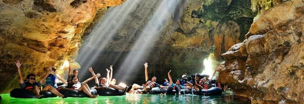Visitors enjoying cave tubing inside Goa Pindul in Gunungkidul, Yogyakarta, Indonesia