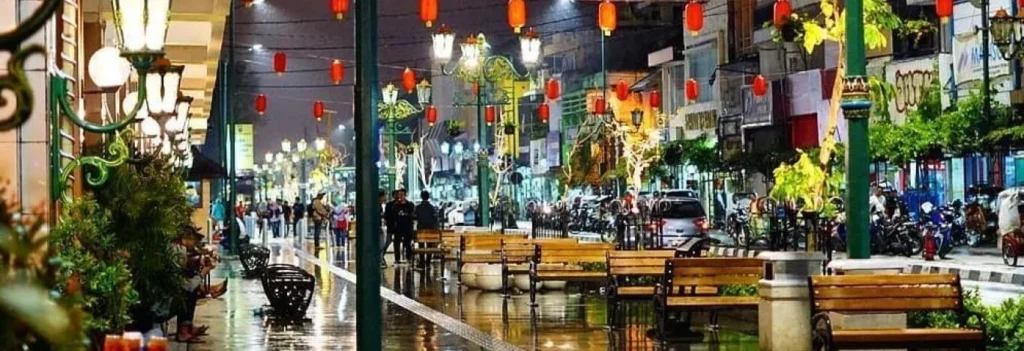 A lively evening view of Malioboro Street in Yogyakarta, Indonesia