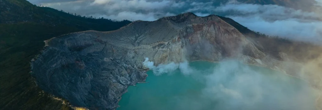 Blue flames rising from the Ijen crater at night in East Java, Indonesia
